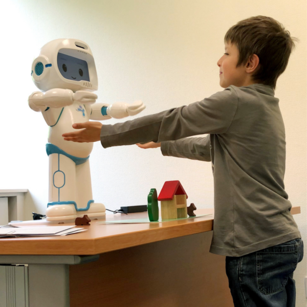 QTrobot interacting with child in therapy session