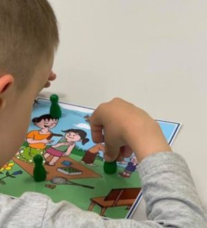 teaching sharing and turn taking to children with autism using a social robot
