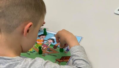 teaching sharing and turn taking to children with autism using a social robot