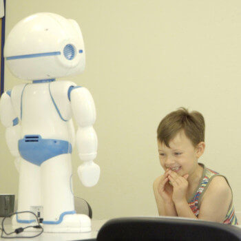 robot engaging a child with autism