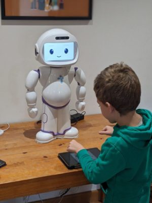 robot tutor helping children with autism to learn at home